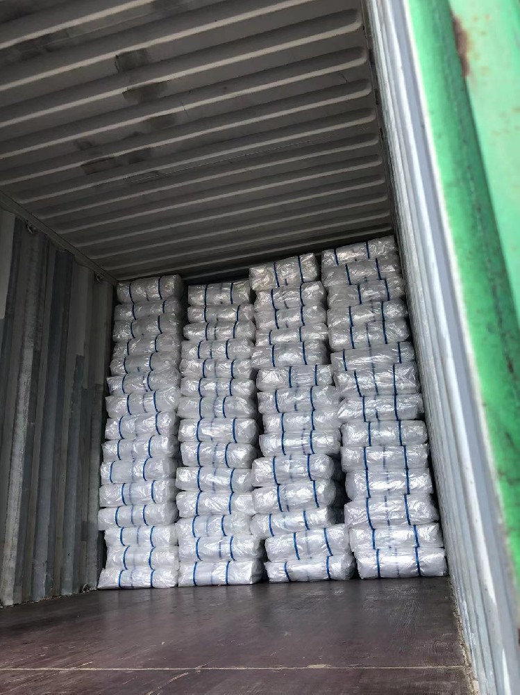 Two containers of orchard cherry rain covers and woven film have been packed